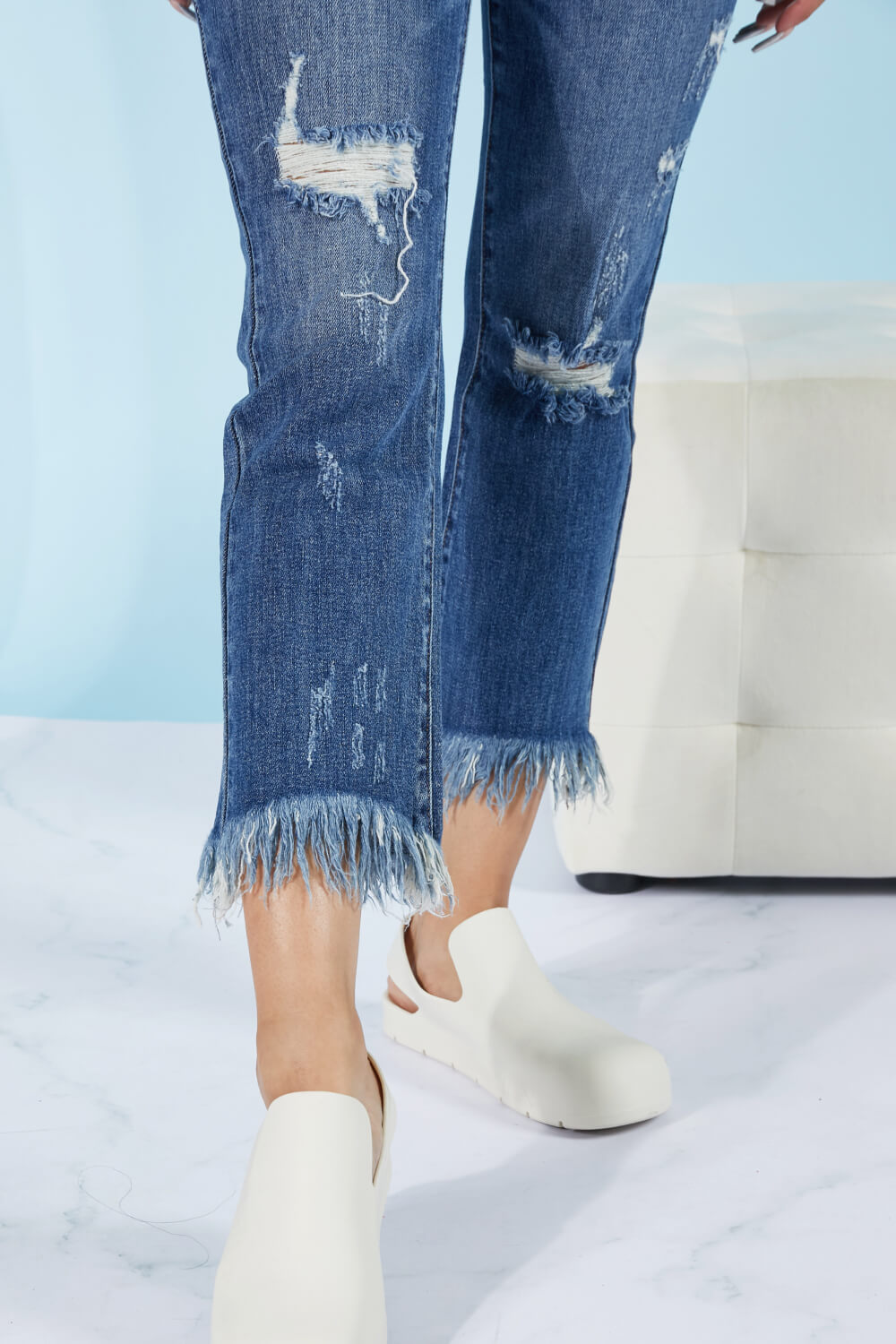 These straight leg jeans really amplify the "undone" look that you're trying to achieve. Not only do these jeans have distressing details throughout the body of the jeans, and at the hem, but also at the waist! To emphasize that unique feature, wear these jeans with a crop top. These are a medium wash. Sizes 5-11.