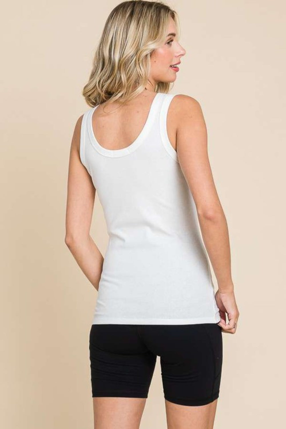 The Ribbed Scoop Neck Tank is a timeless and versatile piece that is a must-have in any wardrobe. Its classic design features a flattering scoop neckline and a ribbed texture, adding a stylish touch to any outfit. This tank top is perfect for layering under cardigans or jackets, or wearing on its own during warmer weather. S-3X