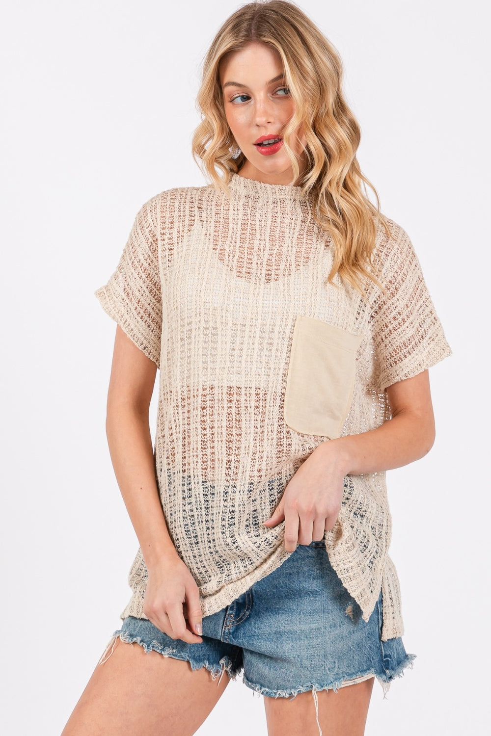 The See Through Crochet Mock Neck Cover Up is a stylish and versatile addition to your wardrobe. Perfect for layering over a swimsuit or pairing with a camisole for a boho-chic look. The intricate crochet detailing adds a touch of texture and visual interest.  S-L