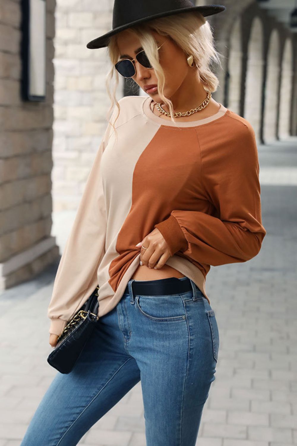“Seeing Double” is a long sleeve sweatshirt featuring coloring blocking, round neckline, raglan sleeves, cuffed sleeves and hemline.The colors are khaki and brown. Sizes small through x-large.