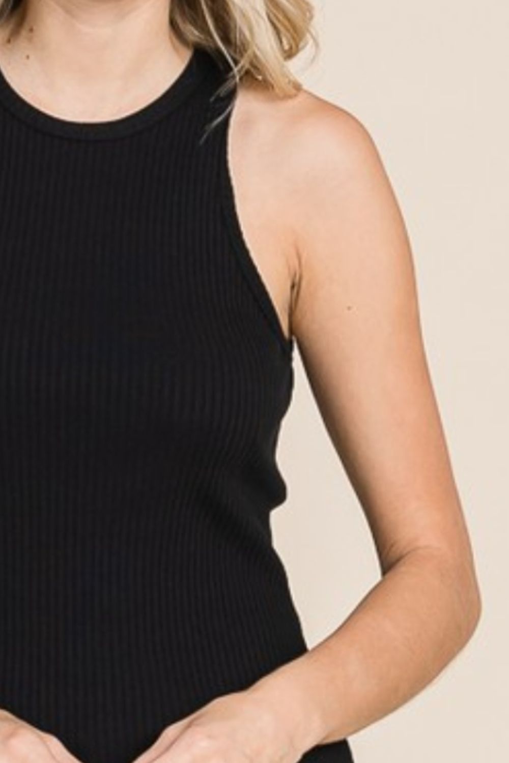 The Ribbed Round Neck Tank is a versatile and essential piece for any wardrobe. This tank top features a classic round neck and a ribbed texture that adds a touch of dimension to your outfit. Perfect for layering or wearing on its own, this tank is a versatile and comfortable option for everyday wear. S-3X