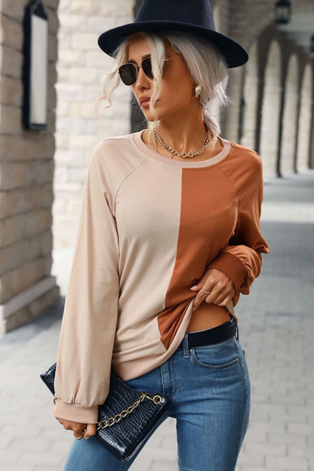 “Seeing Double” is a long sleeve sweatshirt featuring coloring blocking, round neckline, raglan sleeves, cuffed sleeves and hemline.The colors are khaki and brown. Sizes small through x-large.