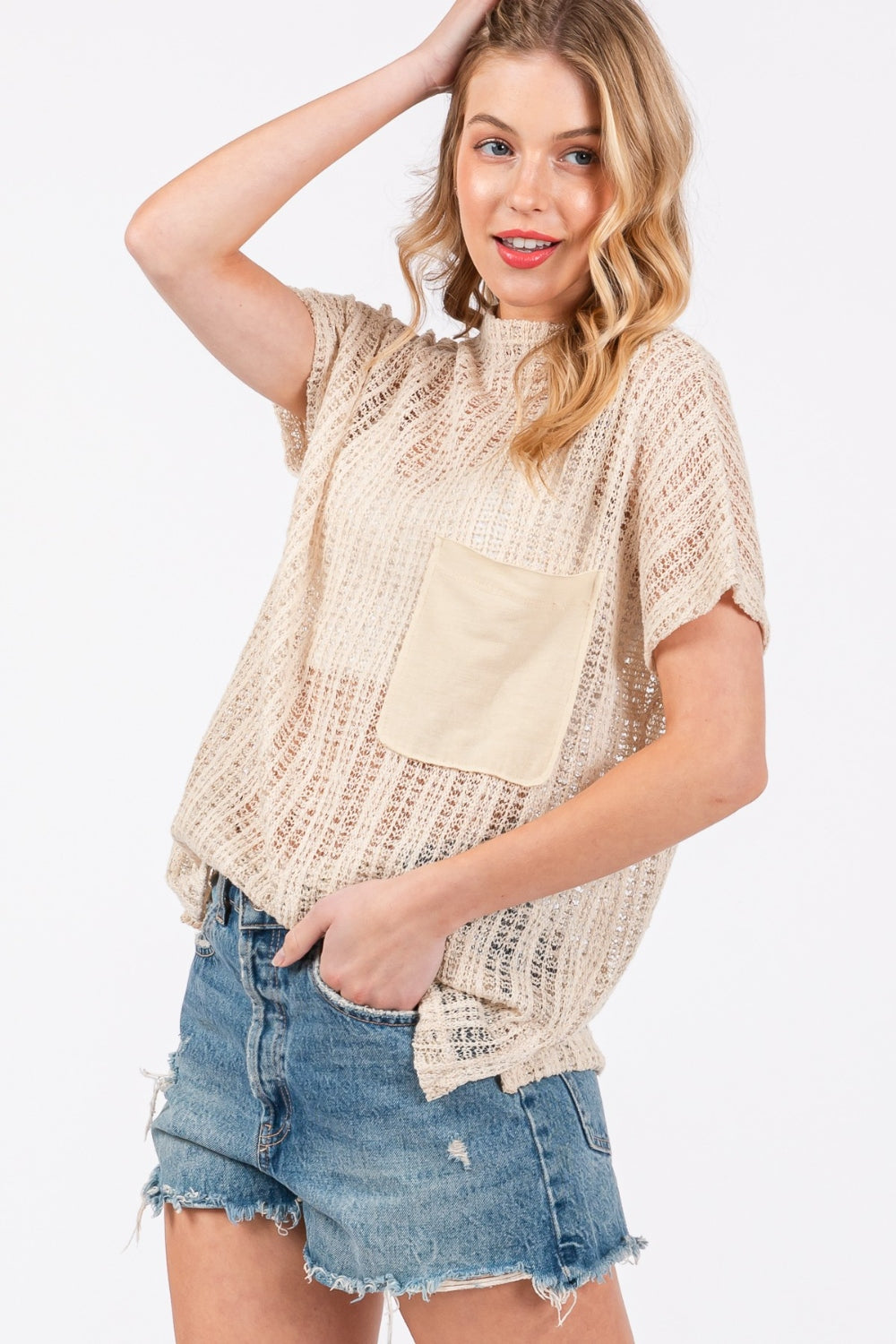 The See Through Crochet Mock Neck Cover Up is a stylish and versatile addition to your wardrobe. Perfect for layering over a swimsuit or pairing with a camisole for a boho-chic look. The intricate crochet detailing adds a touch of texture and visual interest.  S-L