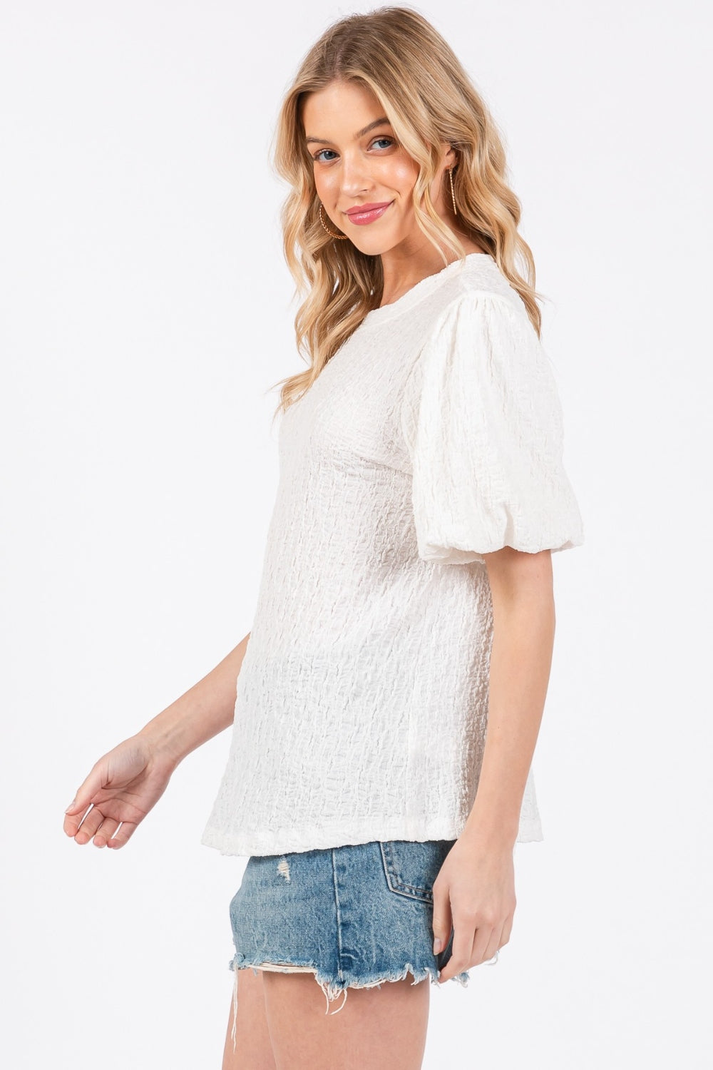 The Textured Puff Sleeve Top is a trendy and feminine top that adds a touch of drama to any outfit. The textured fabric creates visual interest and dimension, making it a standout piece in your wardrobe. The puff sleeves add a playful and romantic vibe to the top, perfect for both casual and dressy occasions. S-L