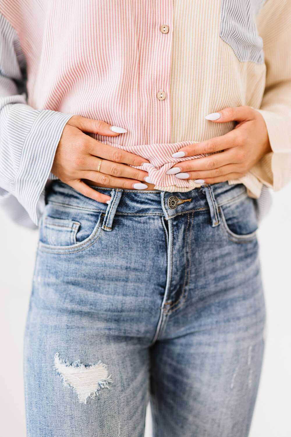 "Melissa Denim" are distressed skinny jeans that are the perfect addition to your wardrobe. They are comfortable and stylish, and can be dressed up or down. The distressed look is perfect for a casual day out, and the skinny fit will show off your curves. These are a medium wash. Sizes 3-11