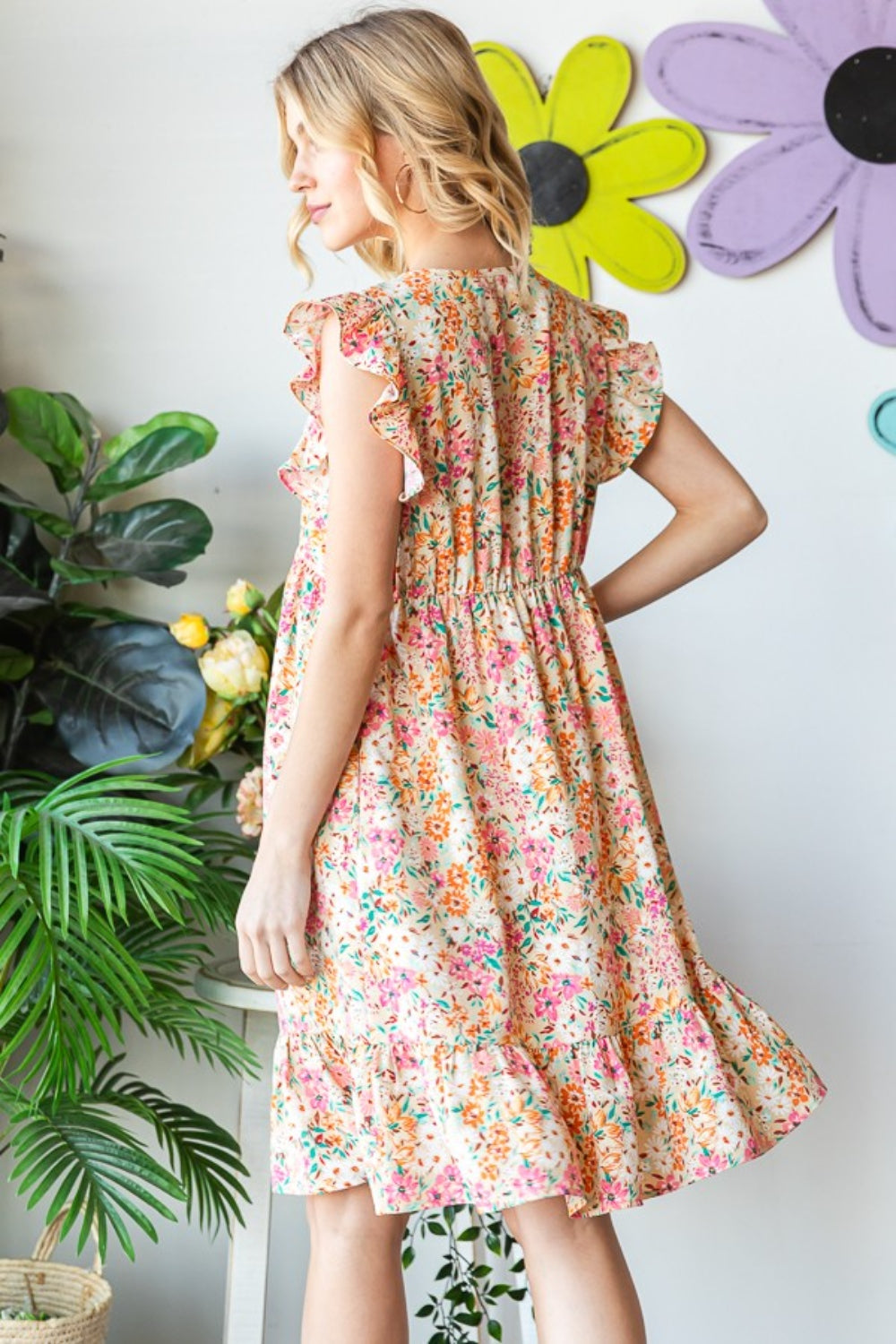 Introducing the Floral Ruffled V-Neck Dress. This stunning dress combines feminine elegance with a touch of playfulness. The floral pattern adds a romantic and vibrant flair, while the ruffled details create a whimsical and graceful look. S - 3X