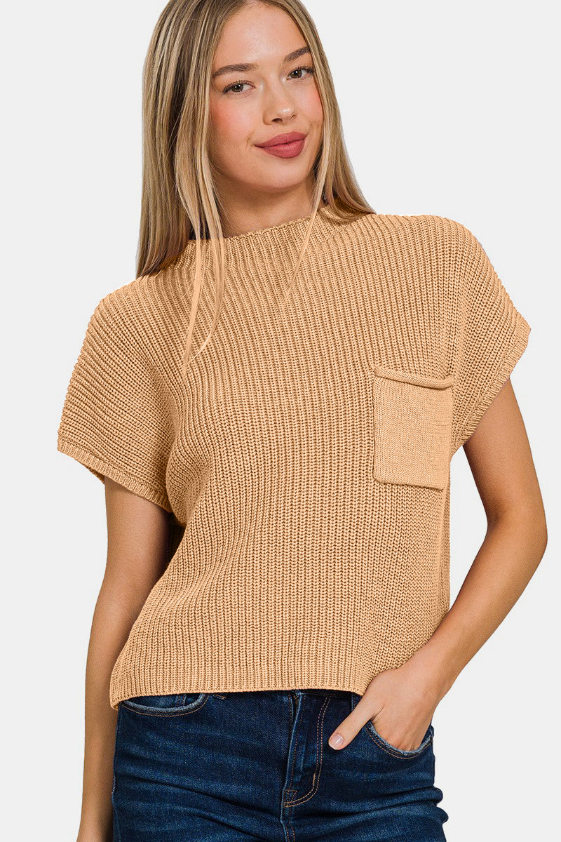 The Mock Neck Short Sleeve Cropped Sweater is a trendy and versatile piece for your wardrobe. With its mock neck design, this sweater adds a modern and chic touch to any outfit. The short sleeves make it perfect for transitioning between seasons or for layering with other pieces. S-L