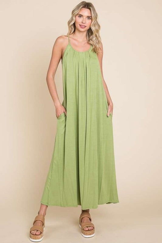 The Pleated Front Neck Maxi Dress is an elegant and sophisticated garment that features a pleated front neckline for a touch of texture and visual interest. This dress exudes a sense of grace and style, making it perfect for special occasions or events where you want to make a statement.  S-XL