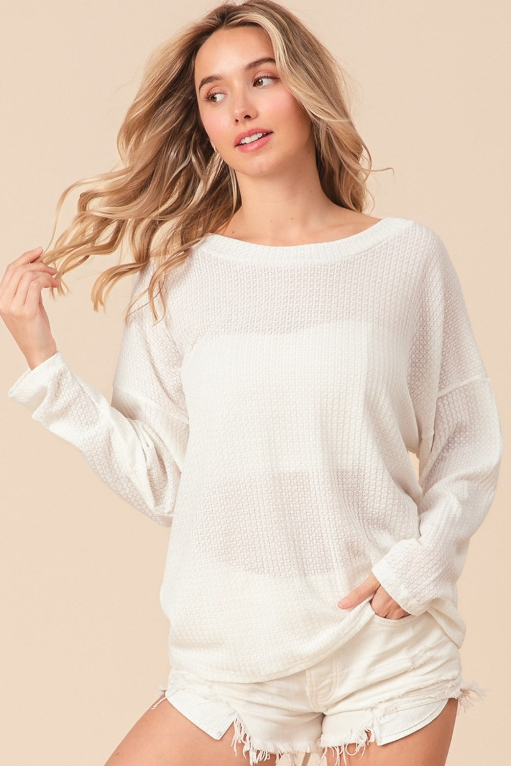 The Waffled Backless Drawstring Top is a flirty and stylish choice for your summer wardrobe. Featuring a waffled texture, this top adds depth and interest to your look. The backless design with a drawstring detail creates a playful and alluring silhouette. S - XL