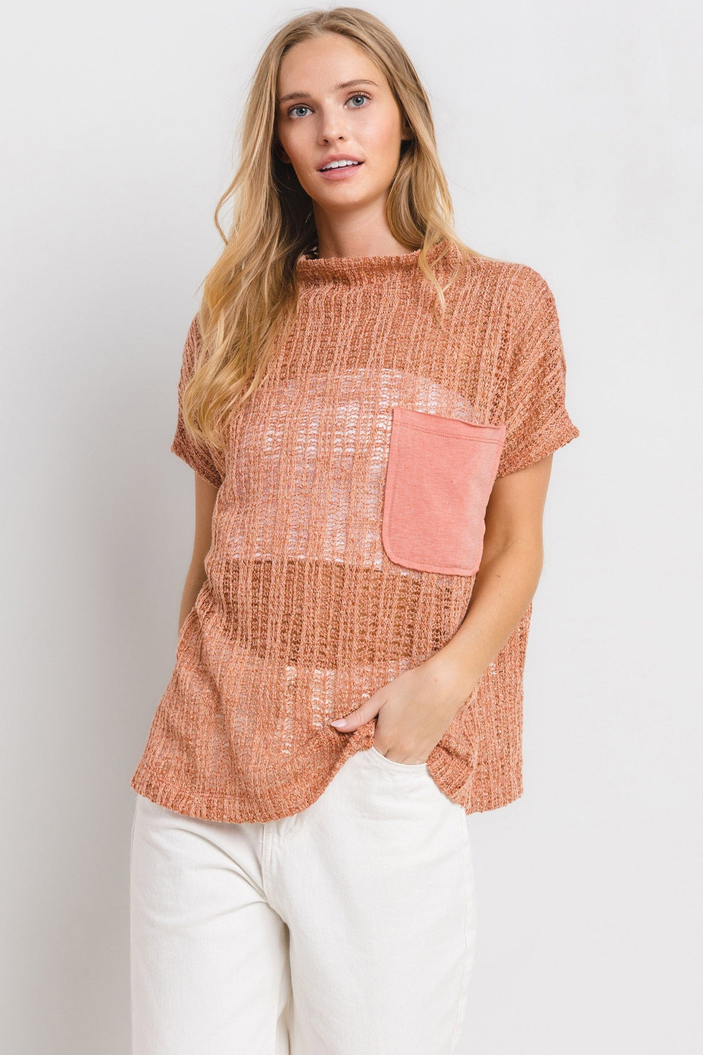 The See Through Crochet Mock Neck Cover Up is a stylish and versatile addition to your wardrobe. Perfect for layering over a swimsuit or pairing with a camisole for a boho-chic look. The intricate crochet detailing adds a touch of texture and visual interest. S-L