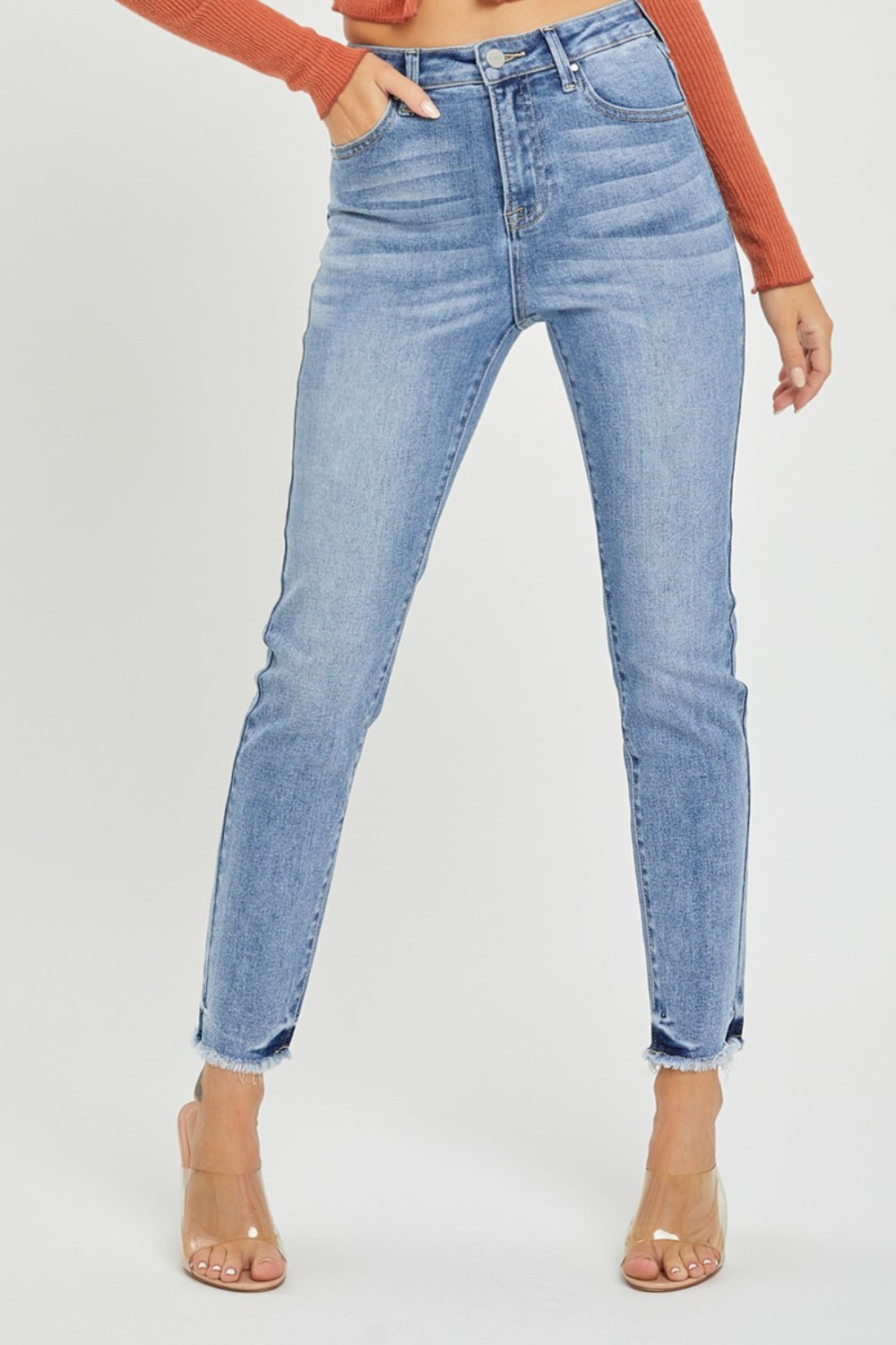 These high rise frayed hem skinny jeans are a trendy and versatile addition to your closet. The high rise design helps create a flattering silhouette and provides extra coverage. The frayed hem adds a touch of edge and style to the classic skinny jeans.  0-3X