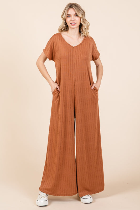 The Ribbed Short Sleeve Wide Leg Jumpsuit is a trendy and versatile fashion piece that offers both style and comfort. With a ribbed texture and wide-leg silhouette, this jumpsuit combines a chic look with a relaxed fit. The short sleeves add a casual touch, making it suitable for various occasions.  S-XL