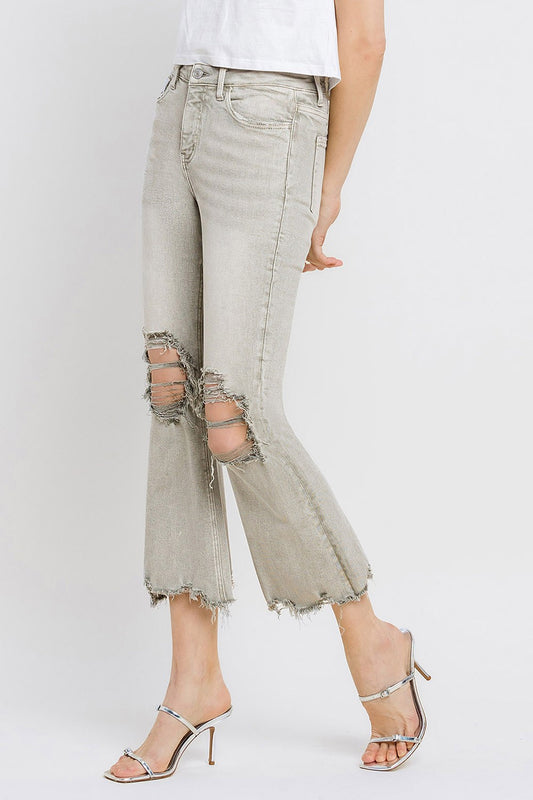 These distressed raw hem cropped flare jeans offer a perfect blend of edgy and retro style. The distressed detailing adds a touch of urban flair to the flared silhouette. The raw hem finishes off the look with a trendy, unfinished edge. Pair these jeans with a tucked-in graphic tee and platform sandals for a vintage-inspired outfit.  24-32