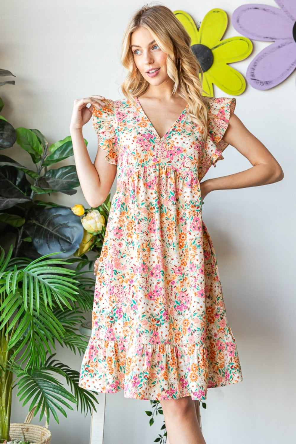 Introducing the Floral Ruffled V-Neck Dress. This stunning dress combines feminine elegance with a touch of playfulness. The floral pattern adds a romantic and vibrant flair, while the ruffled details create a whimsical and graceful look. S - 3X