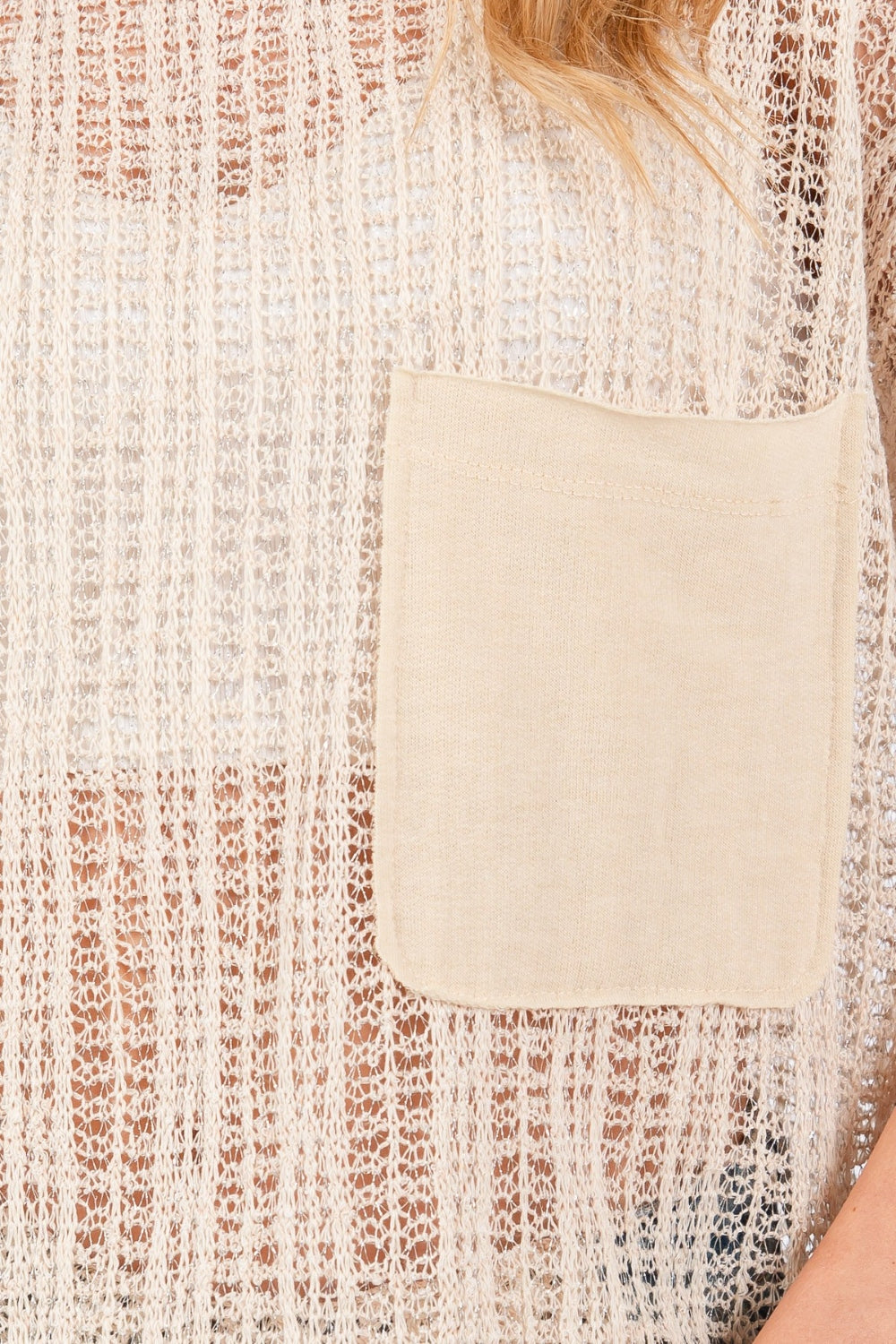 The See Through Crochet Mock Neck Cover Up is a stylish and versatile addition to your wardrobe. Perfect for layering over a swimsuit or pairing with a camisole for a boho-chic look. The intricate crochet detailing adds a touch of texture and visual interest. S-L