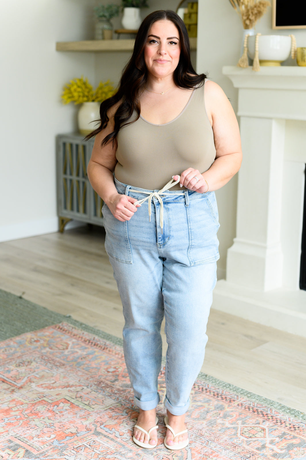 Get a retro-inspired look with our Cooper High Rise Vintage Denim Jogger! This jogger features a high rise design and a light wash for a vintage feel. The self-tie drawstring adds a touch of style, perfect for any casual outing. 0-24w
