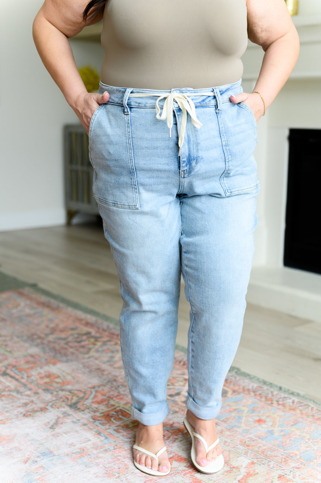 Get a retro-inspired look with our Cooper High Rise Vintage Denim Jogger! This jogger features a high rise design and a light wash for a vintage feel. The self-tie drawstring adds a touch of style, perfect for any casual outing. 0-24w