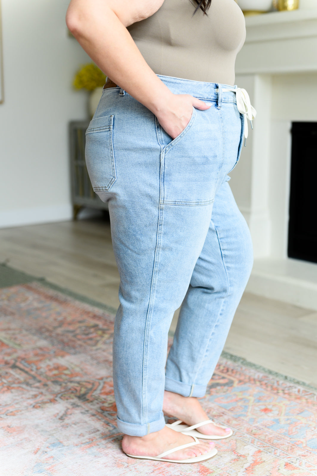Get a retro-inspired look with our Cooper High Rise Vintage Denim Jogger! This jogger features a high rise design and a light wash for a vintage feel. The self-tie drawstring adds a touch of style, perfect for any casual outing. 0-24w