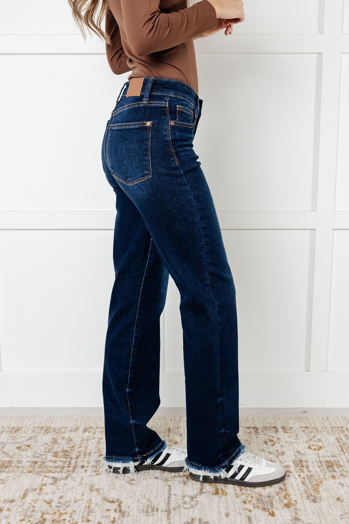The Jacqueline Mid Rise Jean will elevate your casual look with its dark wash and non-distressed design. The straight leg silhouette flatters any figure, while the frayed hem adds a touch of playful flair. Perfect for any occasion, this jean is a must-have for your wardrobe.
Judy Blue
Mid Rise
Zip Fly
Dark Wash
Straight Leg Silhouette
Raw Hem
93% Cotton, 6% Polyester, 1% Spandex
True to Judy Blue Sizing