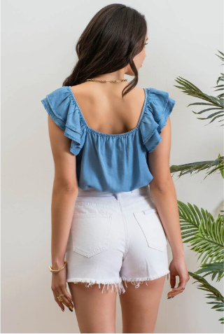 Look sharp and stylish this summer in our "Ashley Chambray Denim" top! Its flattering sweetheart neckline and sassy ruffle sleeves give you a unique, standout look. Plus, the square back neckline with elastic adds comfort! So why wait? Get out there and show off your denim 'look' with attitude.