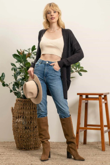 Meet Lizzy – the lightweight, pocket-equipped cardigan designed to keep you warm with style. She's an undercover superhero of sorts, blending effortlessly into any wardrobe and helping you save the day whenever the temperature drops! Perfect for those days when you need an extra layer but don't want the bulk.