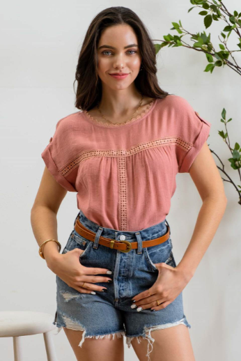 Add a touch of whimsy to your wardrobe with our "Paradise Dusty Apricot" lace top! Featuring round neck and classic lace trim, plus a button tab sleeve and short sleeve, you'll feel like you're in a floral-filled wonderland. (Oh yeah!) So, bring on the romance!
