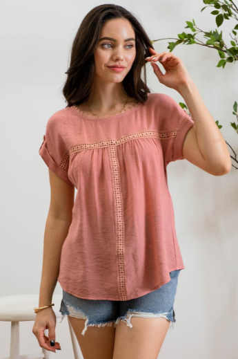 Add a touch of whimsy to your wardrobe with our "Paradise Dusty Apricot" lace top! Featuring round neck and classic lace trim, plus a button tab sleeve and short sleeve, you'll feel like you're in a floral-filled wonderland. (Oh yeah!) So, bring on the romance!