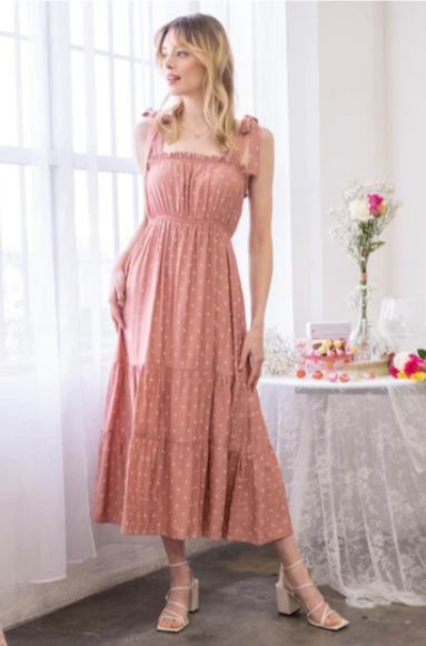 Look oh-so-stylish in this "Lily Terracotta Polka Dot" midi dress! With its square neckline, sleeveless design and tie straps, this dress is everything your summer wardrobe needs. The midi length and tiers give you the perfect shape for any occasion. Let the fun begin!
