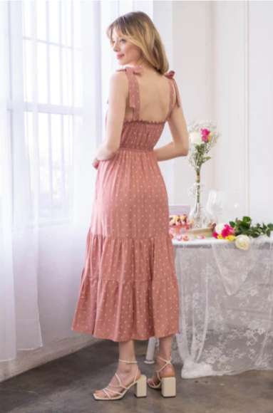 Look oh-so-stylish in this "Lily Terracotta Polka Dot" midi dress! With its square neckline, sleeveless design and tie straps, this dress is everything your summer wardrobe needs. The midi length and tiers give you the perfect shape for any occasion. Let the fun begin!