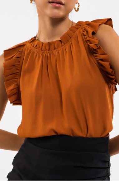 Be your sassiest self in this sleeveless top featuring a perfectly folded, eye-catching ruffle! This rust-hued classic features a woven fabric - so go ahead and look ultra-chic with minimal effort. A top that'll have you sayin' "ruffle-it-up!" Sizes small through large.