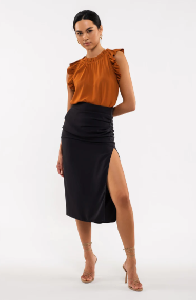 Be your sassiest self in this sleeveless top featuring a perfectly folded, eye-catching ruffle! This rust-hued classic features a woven fabric - so go ahead and look ultra-chic with minimal effort. A top that'll have you sayin' "ruffle-it-up!" Sizes small through large.