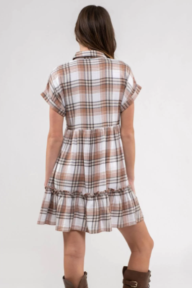 Rock your modern-meets-rustic side in this plaid mini dress! Featuring a collared neckline with button down closure, cinched waist, and a ruffle hem, you'll look fly af (as fashionable) no matter the occasion. With pocket detail, this pleated plaid piece will have you looking cute and stylish all day - yesssss girl! Sizes small through large.