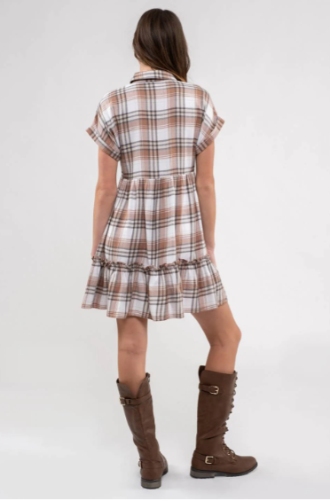 Rock your modern-meets-rustic side in this plaid mini dress! Featuring a collared neckline with button down closure, cinched waist, and a ruffle hem, you'll look fly af (as fashionable) no matter the occasion. With pocket detail, this pleated plaid piece will have you looking cute and stylish all day - yesssss girl! Sizes small through large.