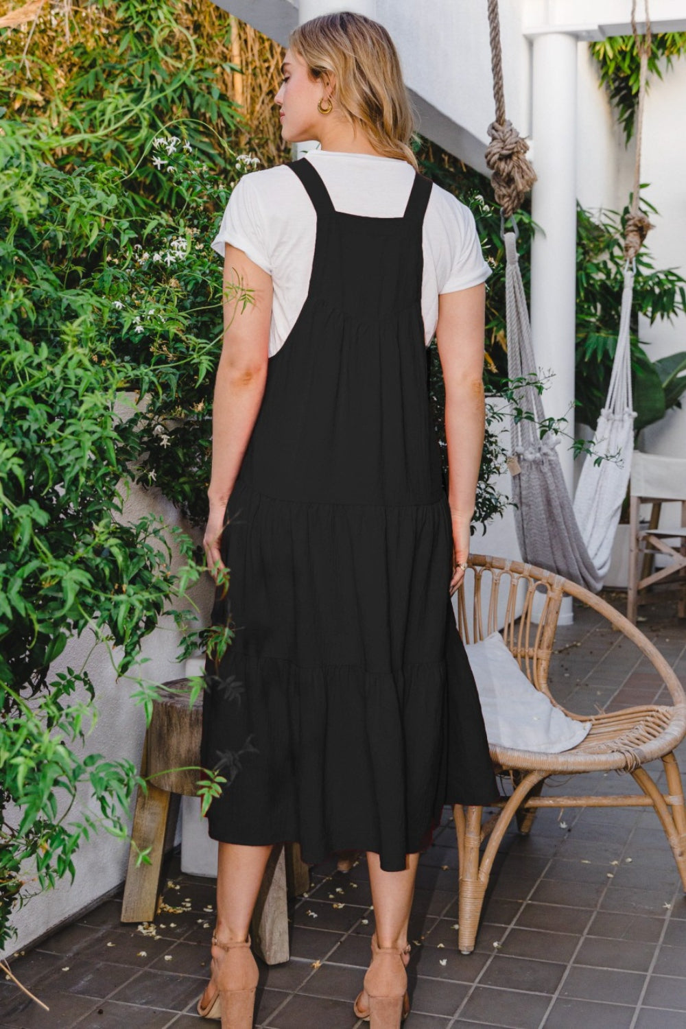Make a statement in this Sleeveless Tiered Midi Dress, featuring a flattering and flowy tiered design that exudes both style and sophistication. The sleeveless silhouette allows for ease of movement and breathability, making it perfect for warm-weather occasions. Crafted from high-quality fabric, this midi dress offers a comfortable and elegant fit that is sure to turn heads. S-3X