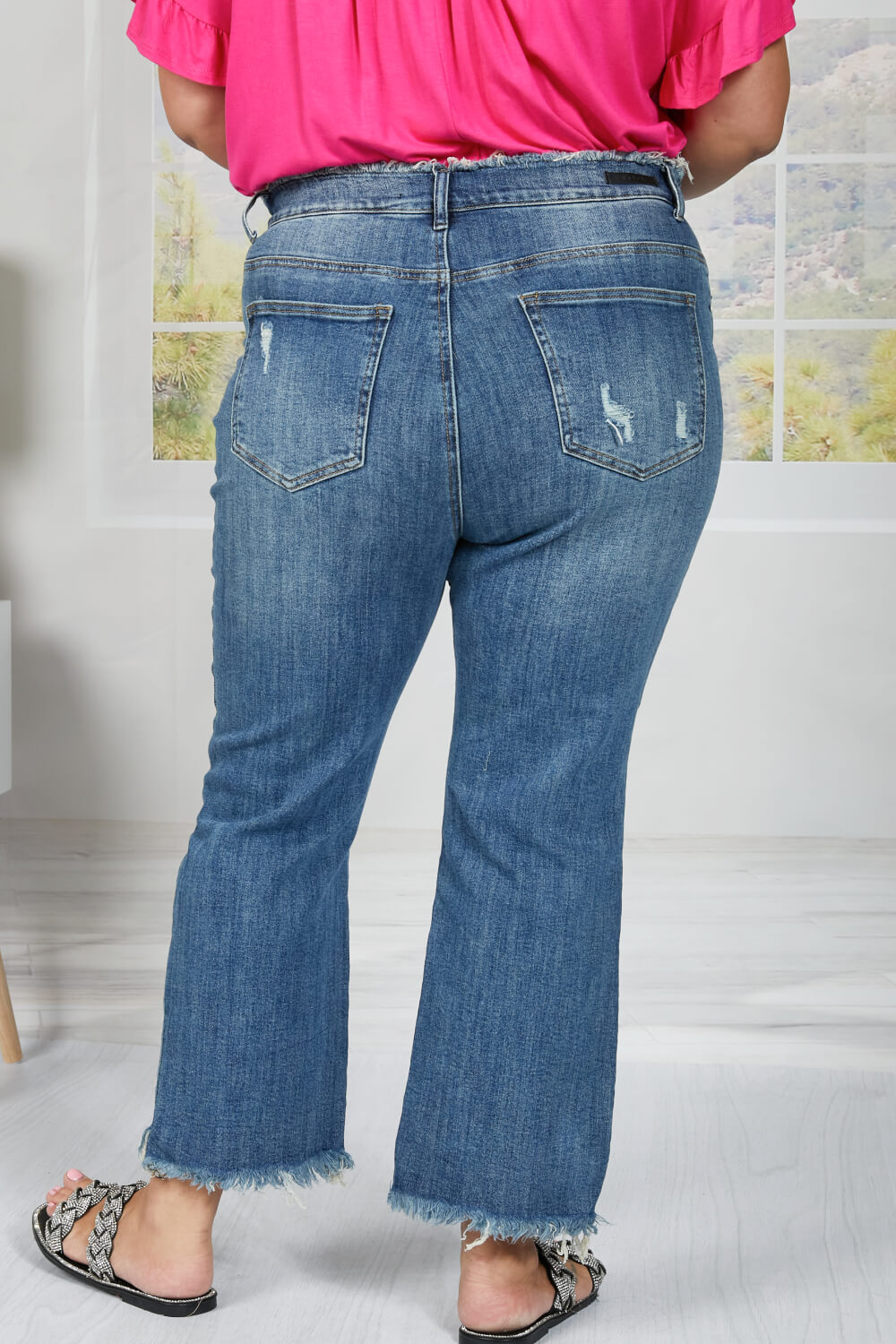 These straight leg jeans really amplify the "undone" look that you're trying to achieve. Not only do these jeans have distressing details throughout the body of the jeans, and at the hem, but also at the waist! To emphasize that unique feature, wear these jeans with a crop top. These are a medium wash. Sizes 5-11.