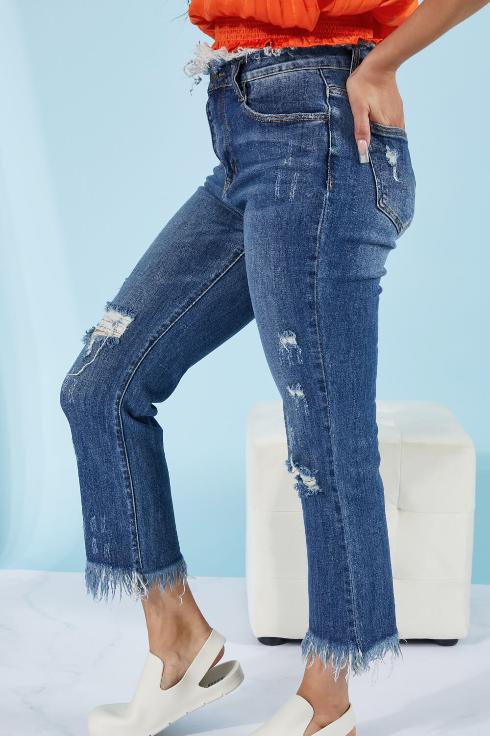These straight leg jeans really amplify the "undone" look that you're trying to achieve. Not only do these jeans have distressing details throughout the body of the jeans, and at the hem, but also at the waist! To emphasize that unique feature, wear these jeans with a crop top. These are a medium wash. Sizes 5-11.