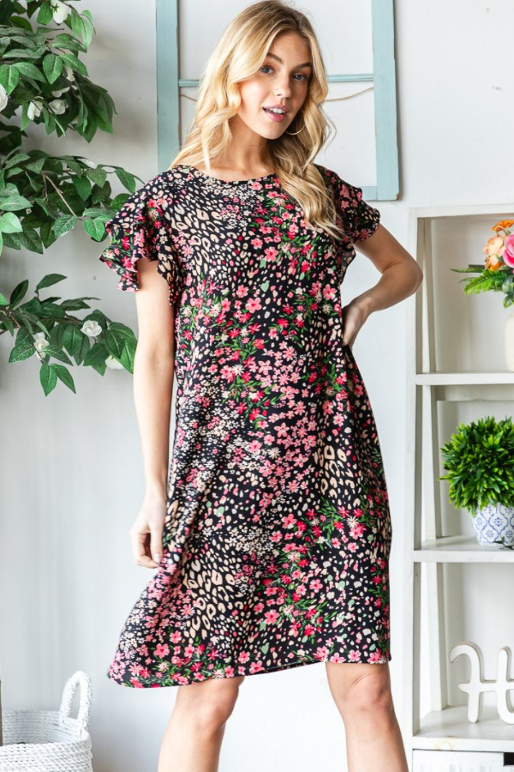 Get ready to turn heads in this stunning Printed Ruffled Short Sleeve Dress. With its eye-catching print and playful ruffled sleeves, this dress exudes feminine charm. The best part? It comes with pockets, adding a practical touch to this stylish piece. S - 3X