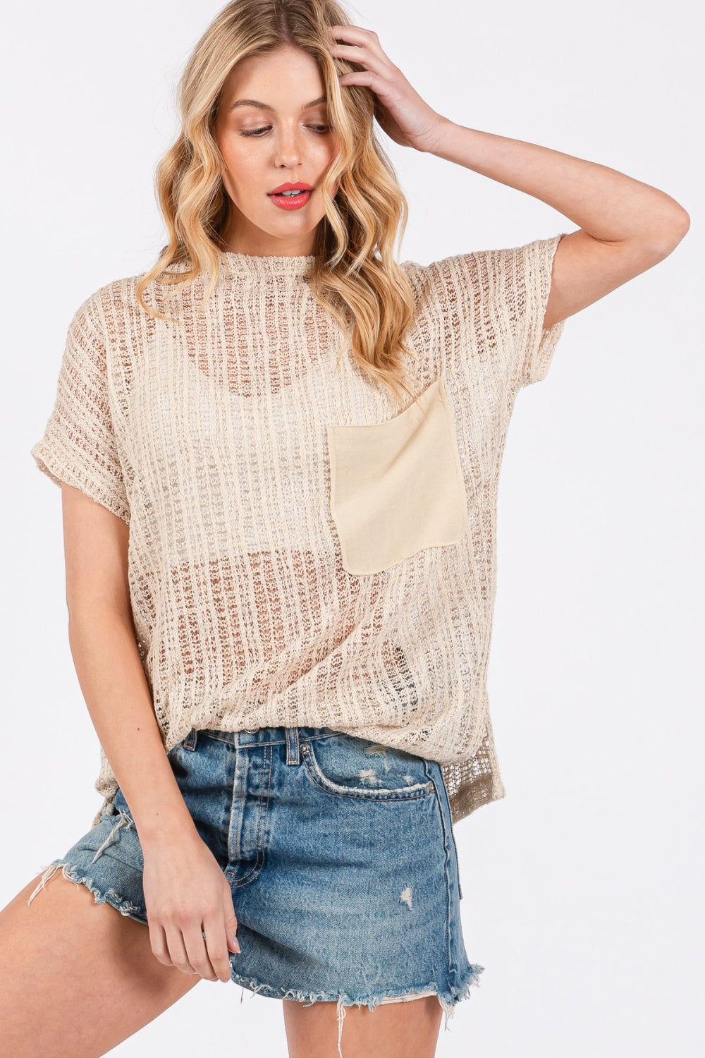 The See Through Crochet Mock Neck Cover Up is a stylish and versatile addition to your wardrobe. Perfect for layering over a swimsuit or pairing with a camisole for a boho-chic look. The intricate crochet detailing adds a touch of texture and visual interest.  S-L