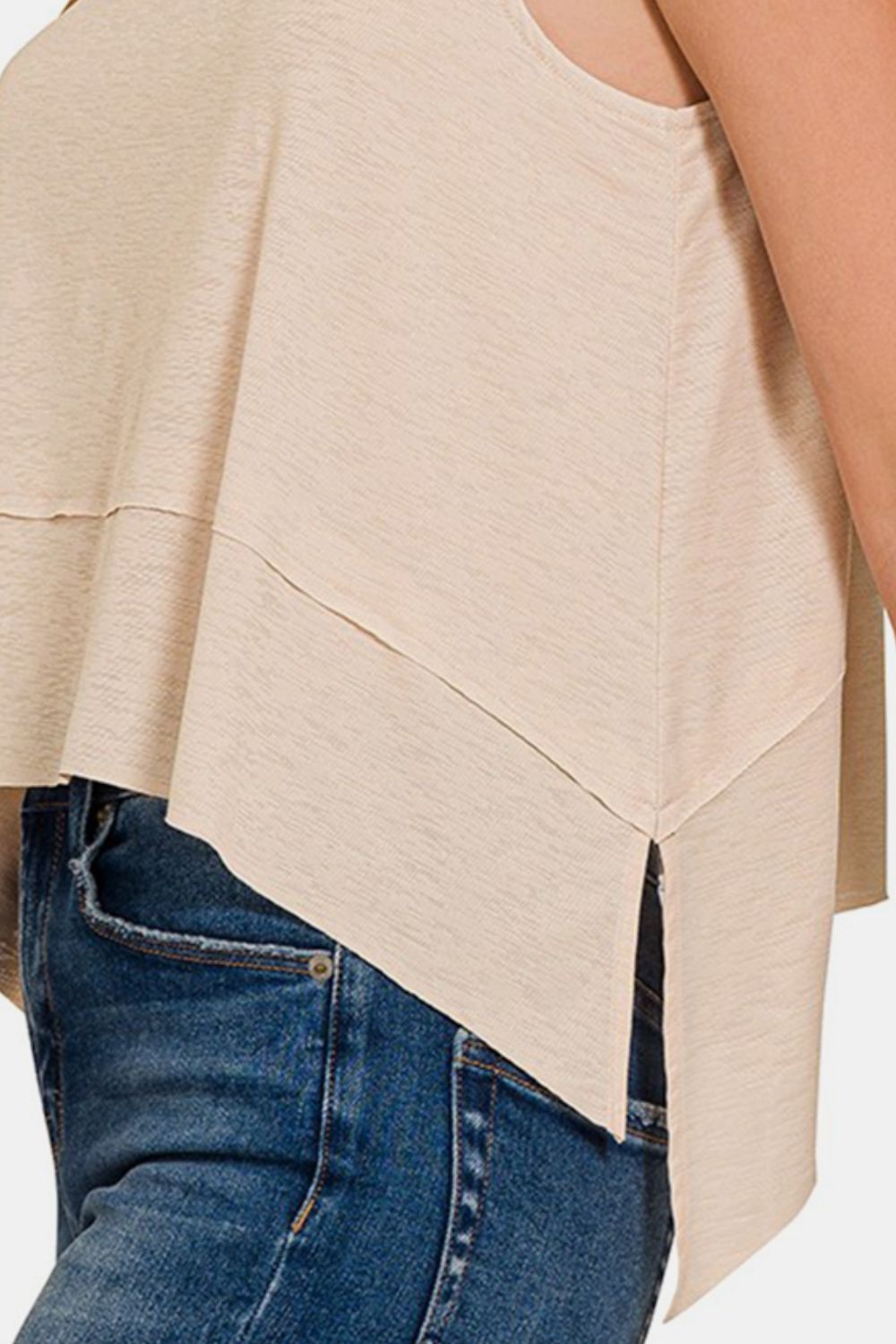 Exposed Seam Slit Round Neck Tank is a modern and stylish wardrobe essential. The exposed seam detailing adds a trendy touch to this classic tank top, giving it an edgy and contemporary look. With a round neck and slit detailing, this tank is versatile and can be dressed up or down for any occasion. S-L