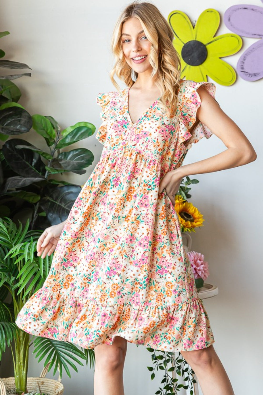 Introducing the Floral Ruffled V-Neck Dress. This stunning dress combines feminine elegance with a touch of playfulness. The floral pattern adds a romantic and vibrant flair, while the ruffled details create a whimsical and graceful look. S - 3X