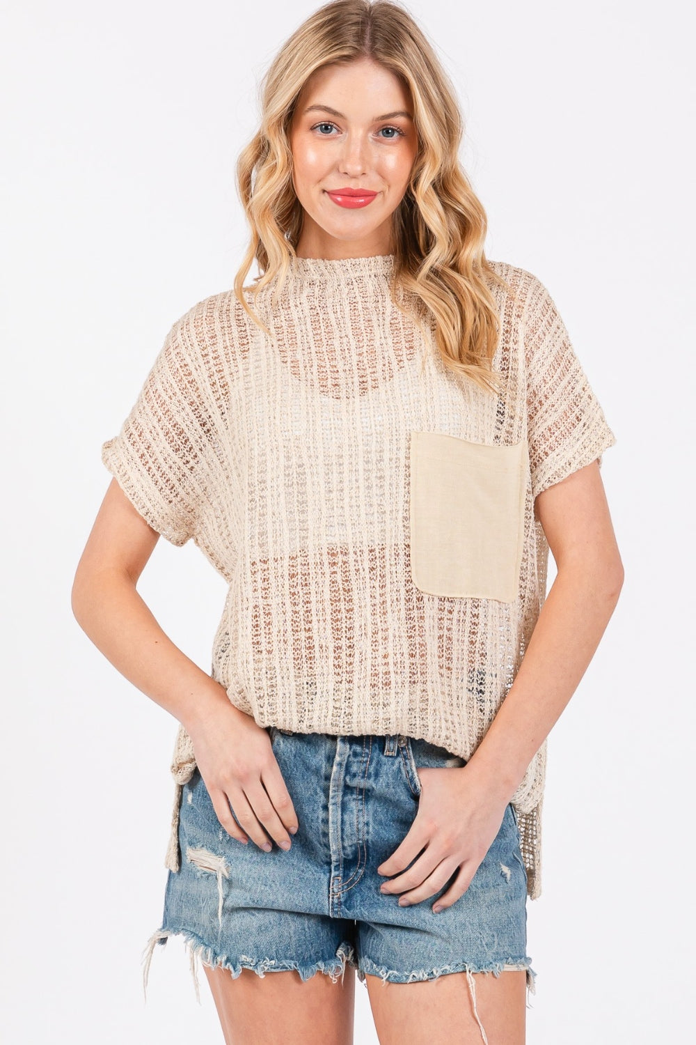 The See Through Crochet Mock Neck Cover Up is a stylish and versatile addition to your wardrobe. Perfect for layering over a swimsuit or pairing with a camisole for a boho-chic look. The intricate crochet detailing adds a touch of texture and visual interest. S-L