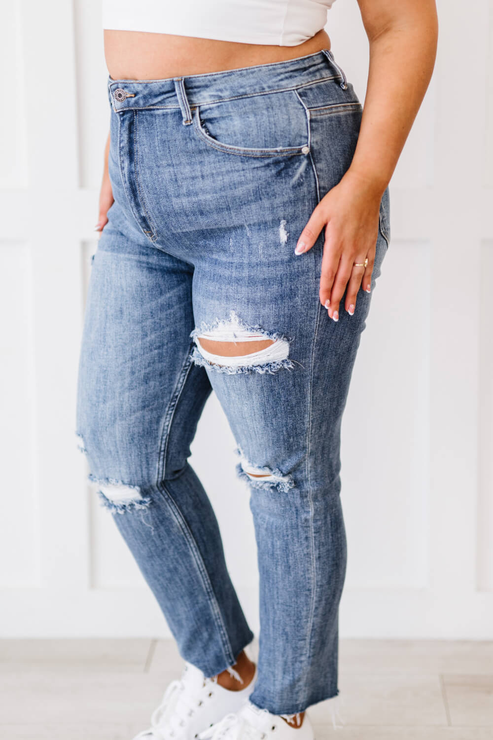 "Melissa Denim" are distressed skinny jeans that are the perfect addition to your wardrobe. They are comfortable and stylish, and can be dressed up or down. The distressed look is perfect for a casual day out, and the skinny fit will show off your curves. These are a medium wash. Sizes 3-11