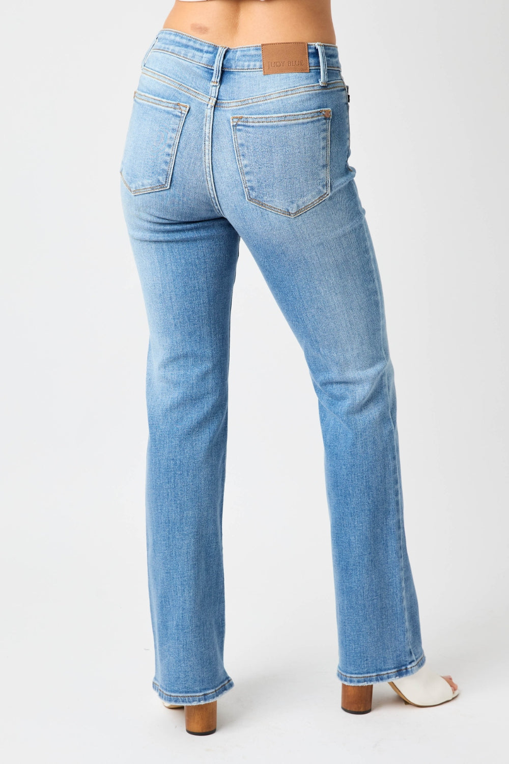 These high waist straight jeans are a timeless and classic wardrobe essential. The high waist design elongates the legs and provides a flattering silhouette. The straight leg cut offers a versatile and polished look that is easy to style. Pair them with a tucked-in blouse or a cropped top for a chic outfit. 0-24W