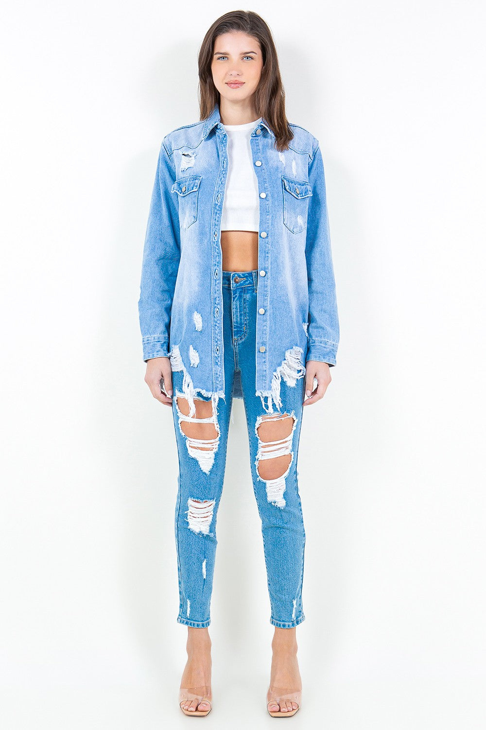 Introducing the Frayed Hem Distressed Denim Shirt Jacket. This stylish piece combines the timeless appeal of denim with a contemporary twist. The frayed hem adds a touch of edginess, while the distressed details create a worn-in look.  S - 3X