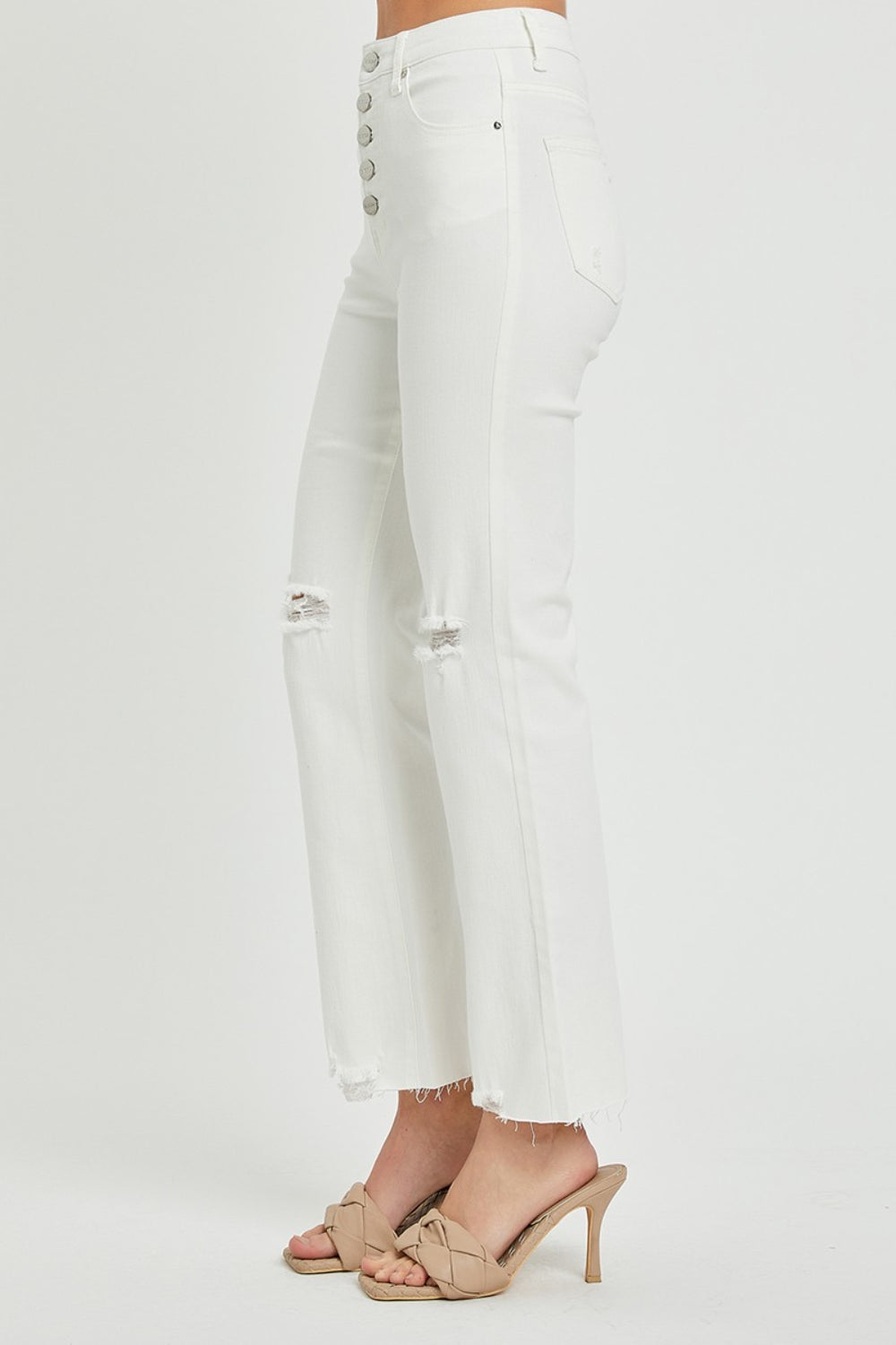 These high rise button fly straight ankle jeans are a stylish and on-trend choice for your everyday wardrobe. The high rise design creates a flattering and elongated silhouette. The button fly adds a touch of vintage charm and detail to the jeans. The straight leg cut offers a classic and versatile look that can be dressed up or down.