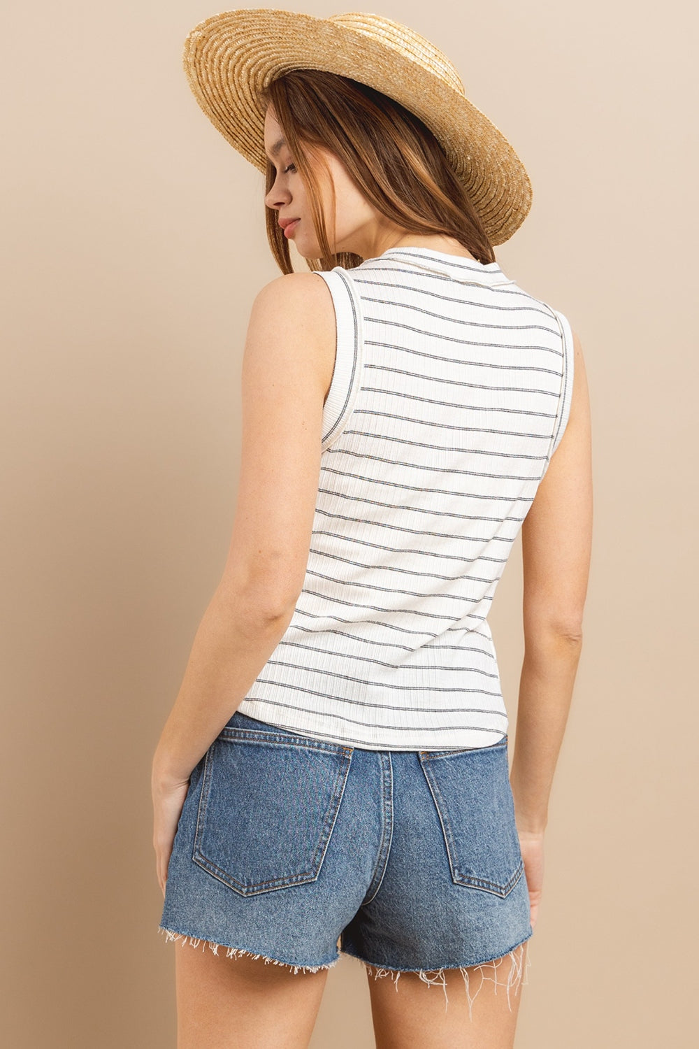 Stay cool and stylish this summer with our Striped Round Neck Tank. Made from soft and breathable fabric, this tank features a classic round neck design and trendy striped pattern. Perfect for pairing with your favorite jeans or shorts for a casual and chic look. Available in a variety of colors to suit your style preferences.  S-L