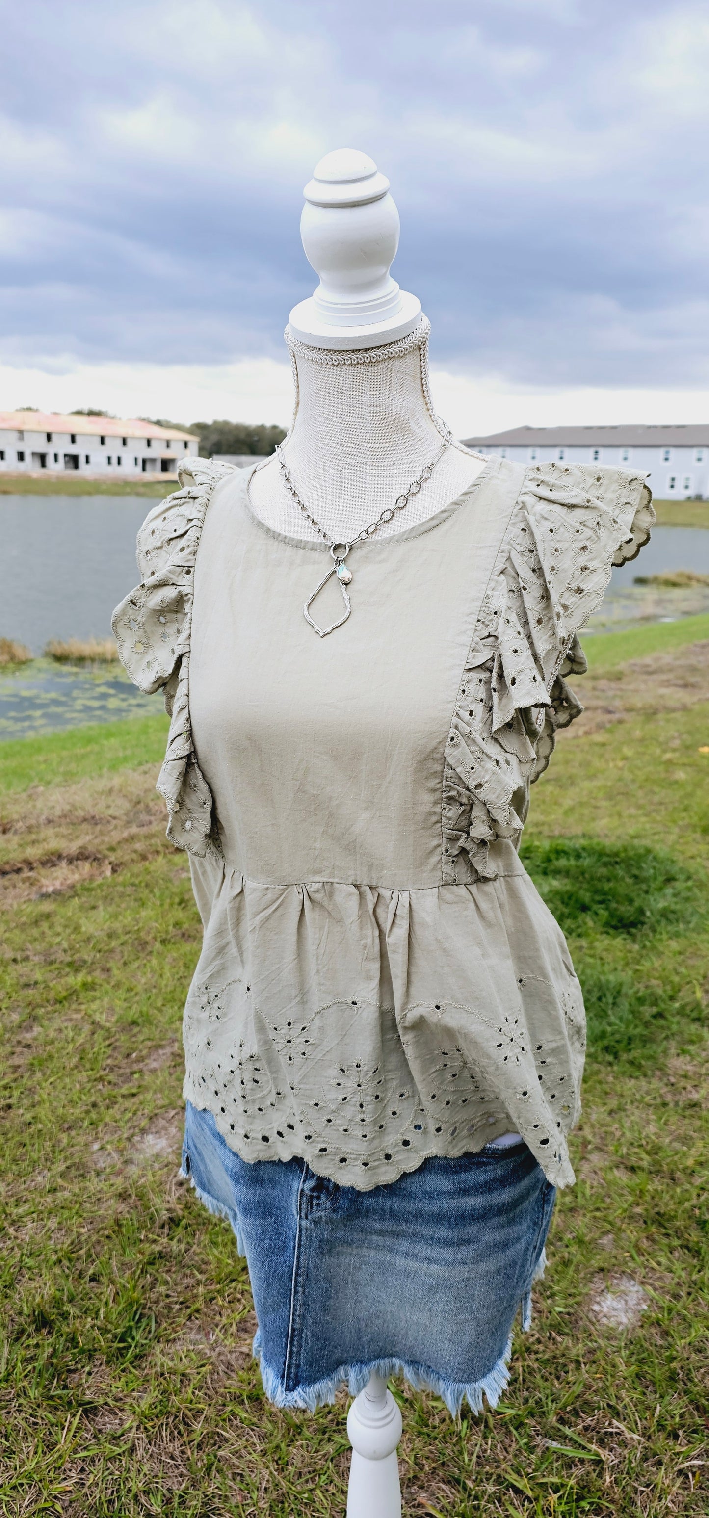 Shhh! Don’t tell anyone, but I like you! “Secret Crush” features ruffled lace trim short sleeves with eyelet design, scalloped hemline, keyhole back with button enclosure, and rounded neckline. This top is great for vacation, those hot summer days, or a shopping day with your friends. Sizes small through large.