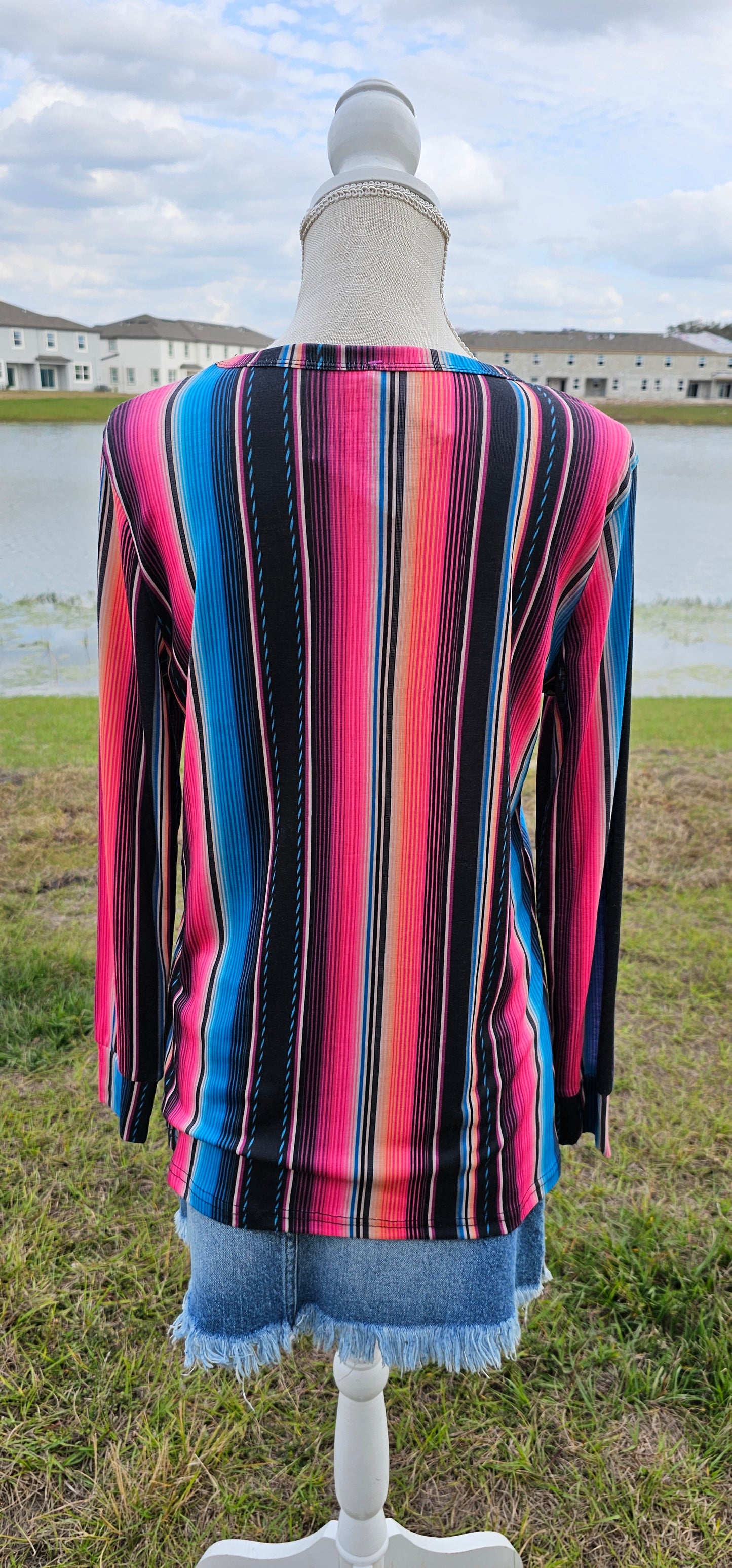 Imagine yourself in this long sleeve bright colored top that has a black mesh V cut-out. The sleeves offer a cuff for that nice fit. The bright colors really make this top pop. Going to the rodeo, line dancing, hanging out with family and friends, or just because, this top will be a great addition to your wardrobe. Sizes small through x-large.