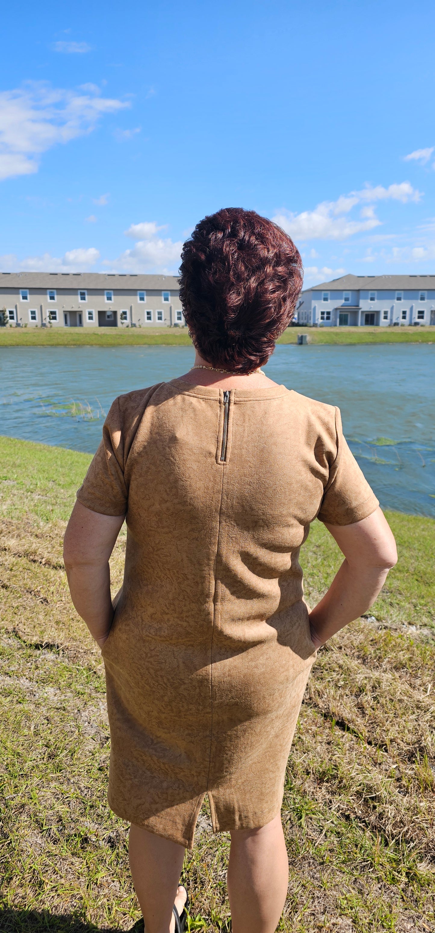 Dress to impress in this "Winona Mocha Printed Suede Shift Dress" and show off your country flair! With its round neckline, short sleeves, side pockets, and zipper back closure, it’s sure to be your go-to look for any special occasion. Yee-haw! Sizes small through large.