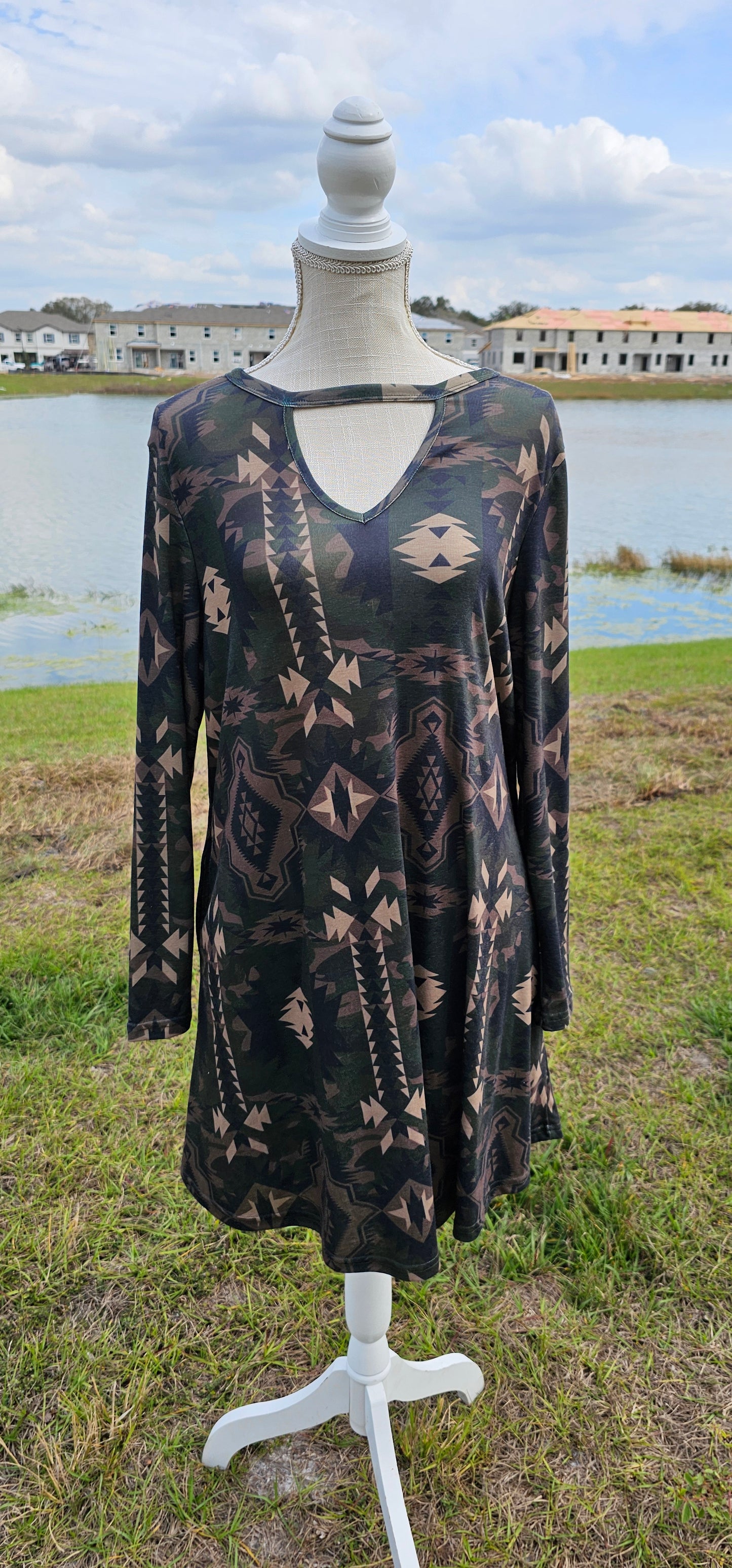This dress features an Aztec design, key hole cut-out neckline, long sleeves, roomy and comfy. It has pockets! The colors are a camouflage. Imagine yourself wearing this cute number to the rodeo, going out on the town, hanging out with family and friends, you will be comfortable however you choose to wear your dress. Sizes small through x-large.